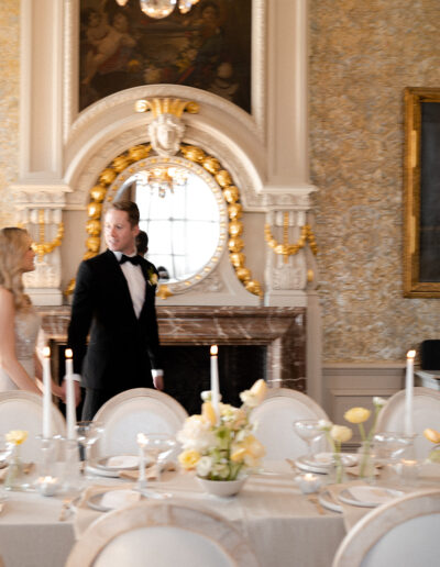 A colour image of a bride and groom at their wedding venue