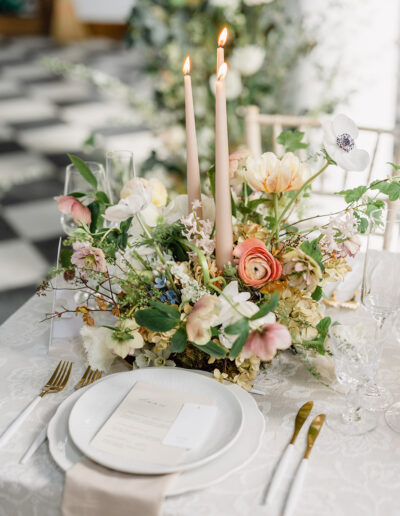 A colour image of a wedding table with flowers planned by a luxury wedding planner