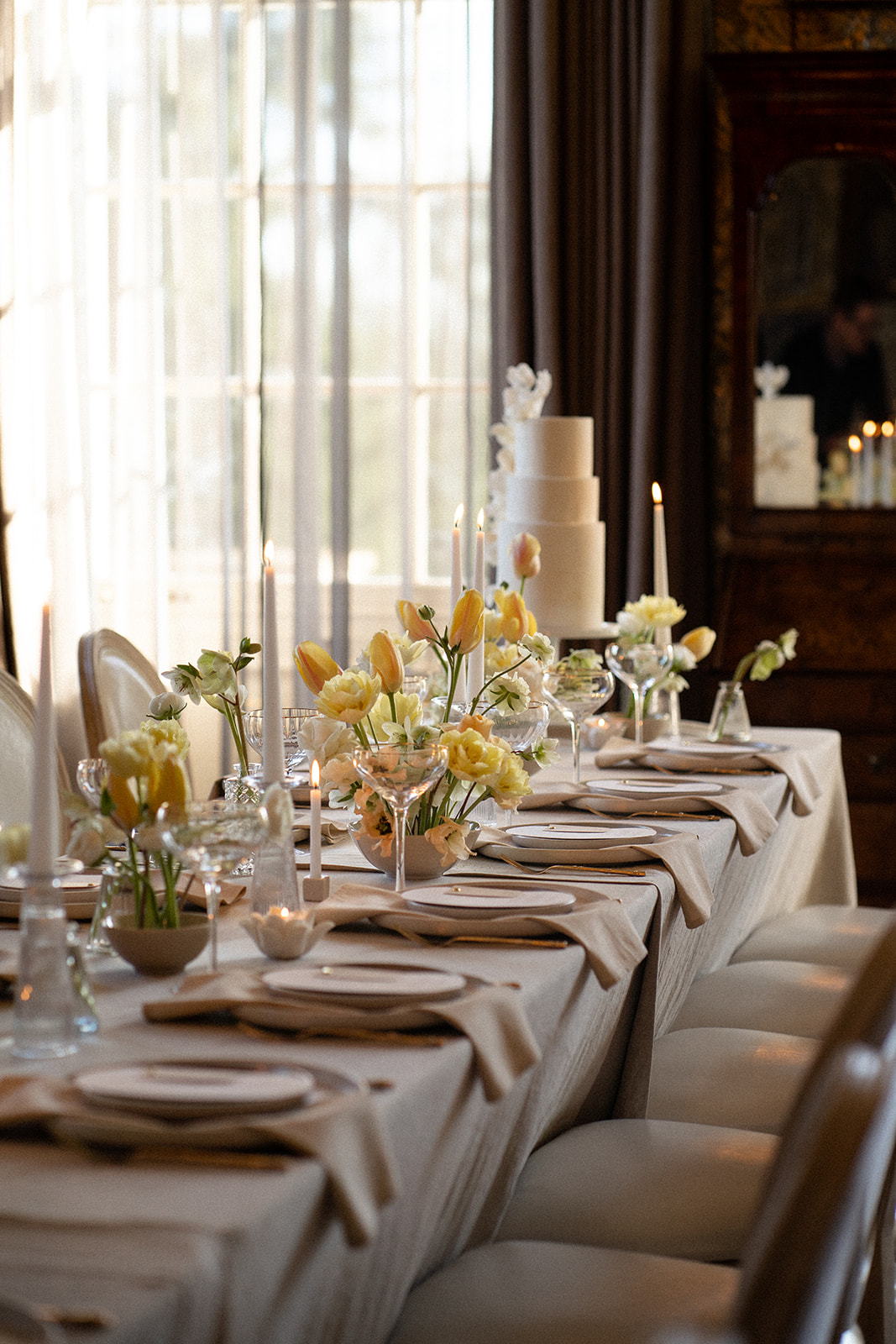 A wedding seating chart and table plan with flowers at the base.