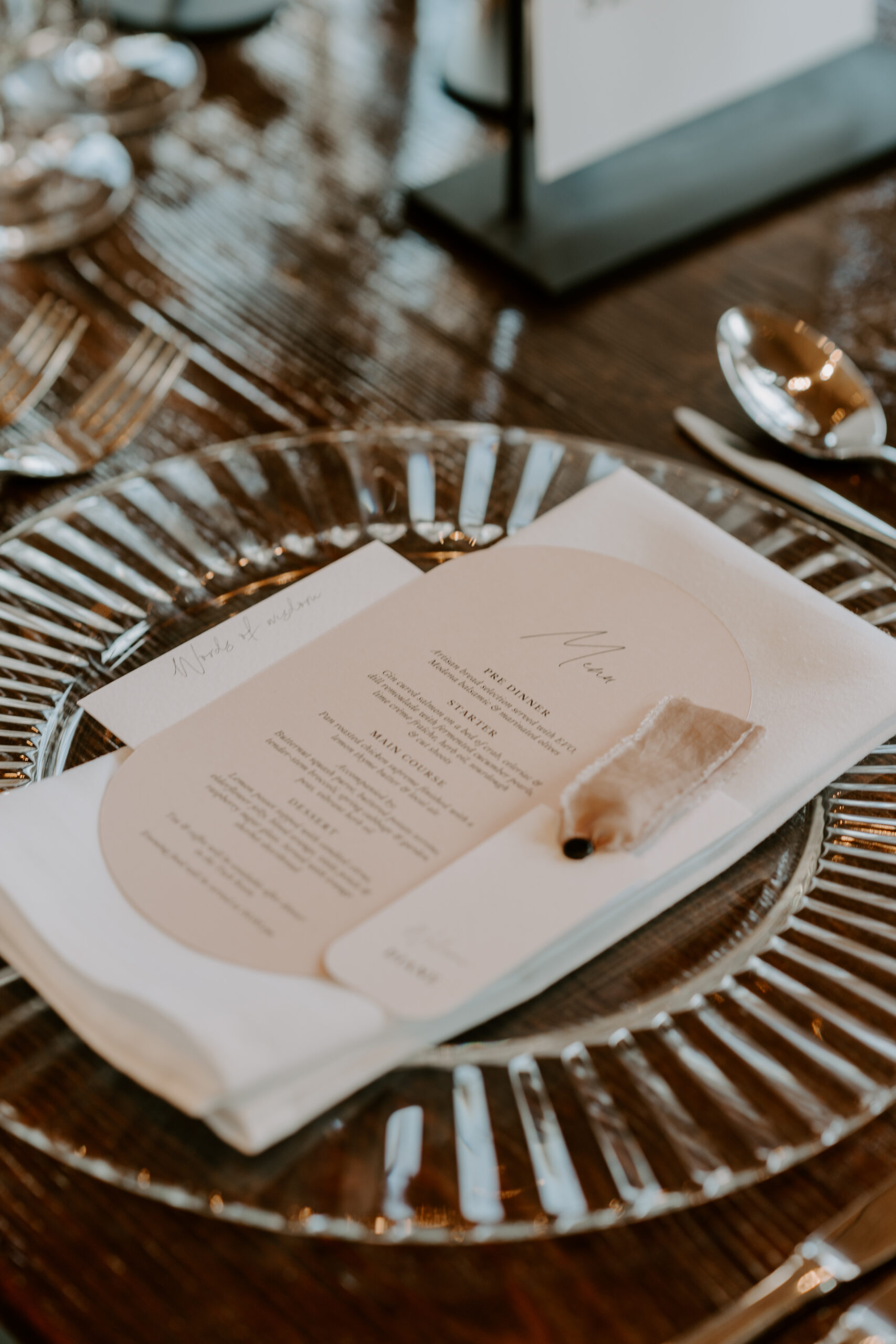 A table setting with wedding styling and silverware.