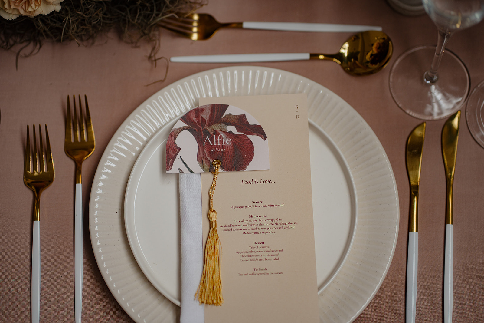 A table set up with white flowers and wedding styling.