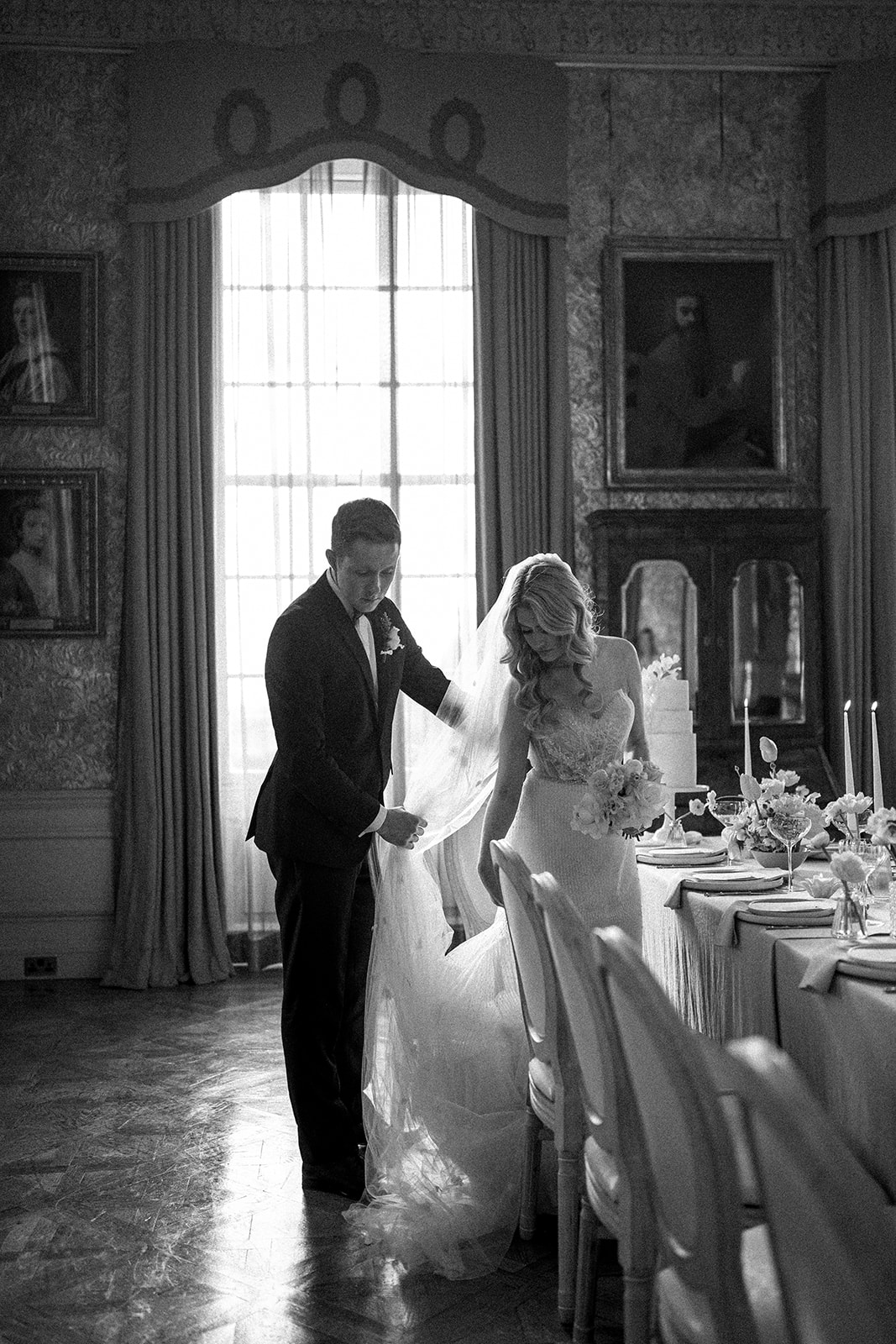 A black and white image of a bride and groom at their cheshire wedding venue