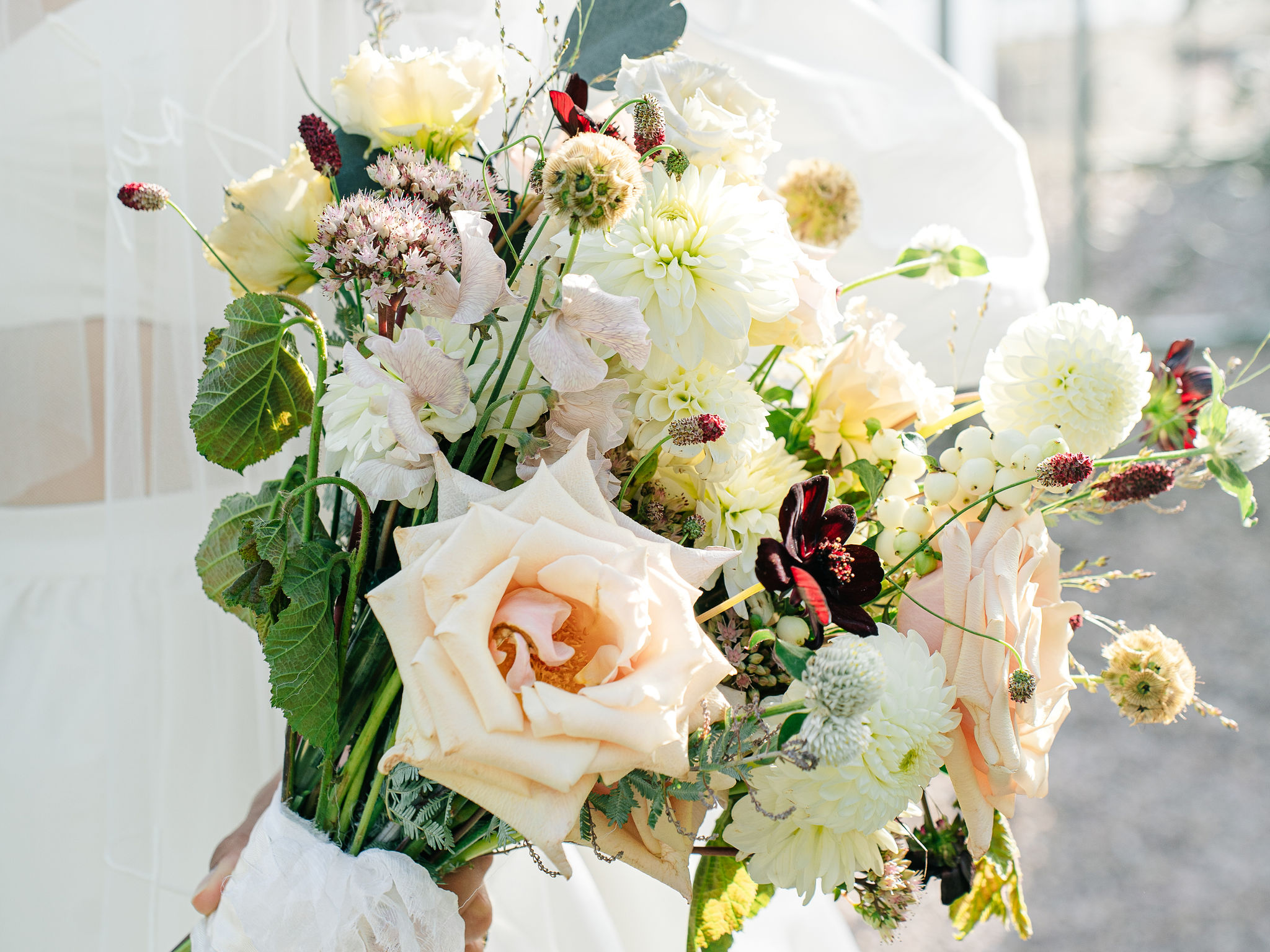 A colour images of a bridal wedding bouquet by Olive Owl wedding floristry at Capesthorne Hall wedding venue in Cheshire