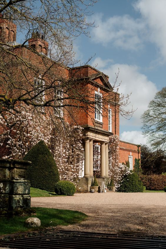 A black and white images of a bride and groom at Capesthorne Hall in Cheshire