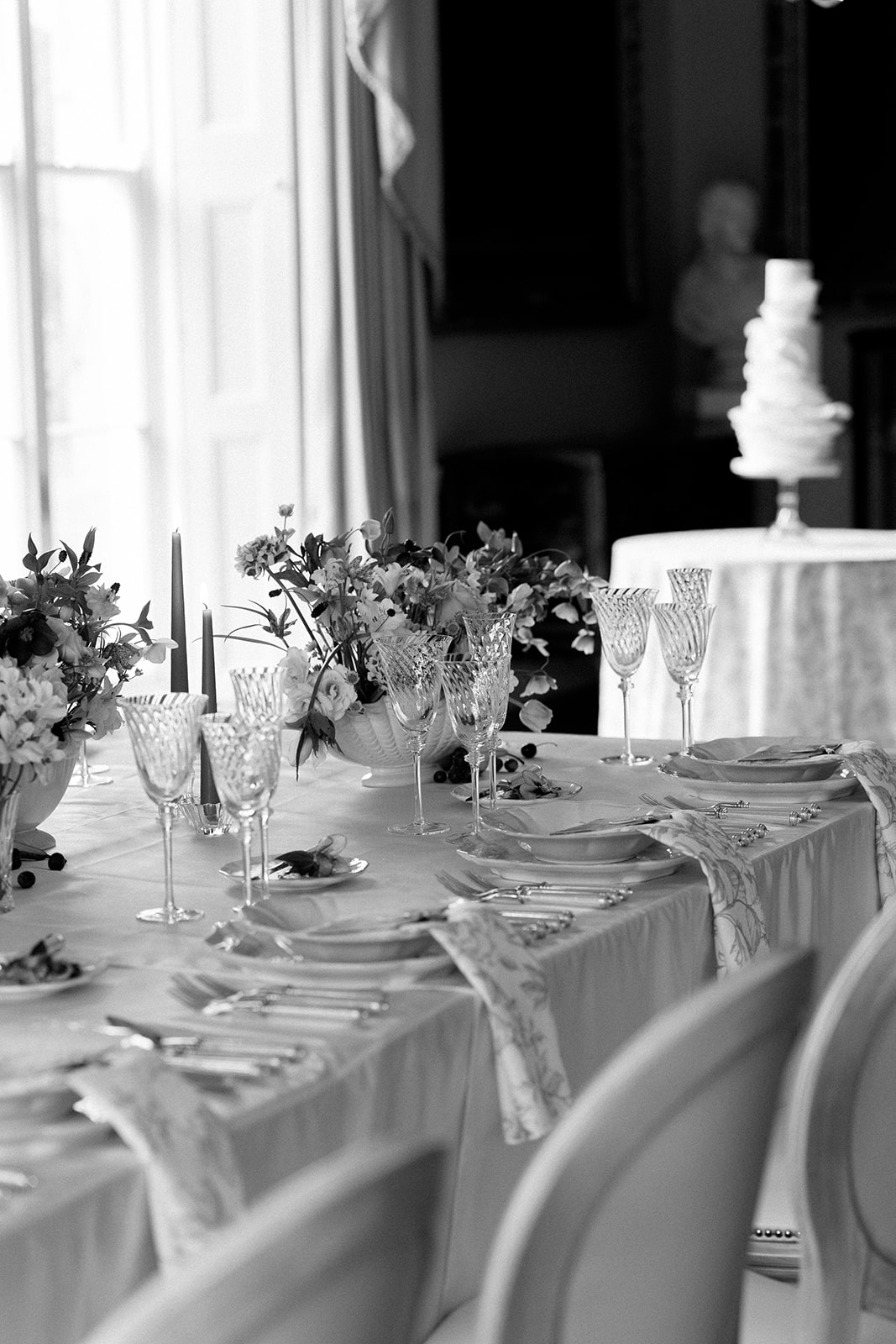 Birdsall House A table set up with white flowers and wedding styling.