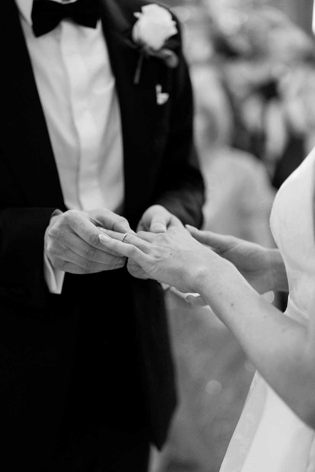 Madeleine & Chris A black and white image of wedding vows taking place at Capesthorne Hall in Cheshire.