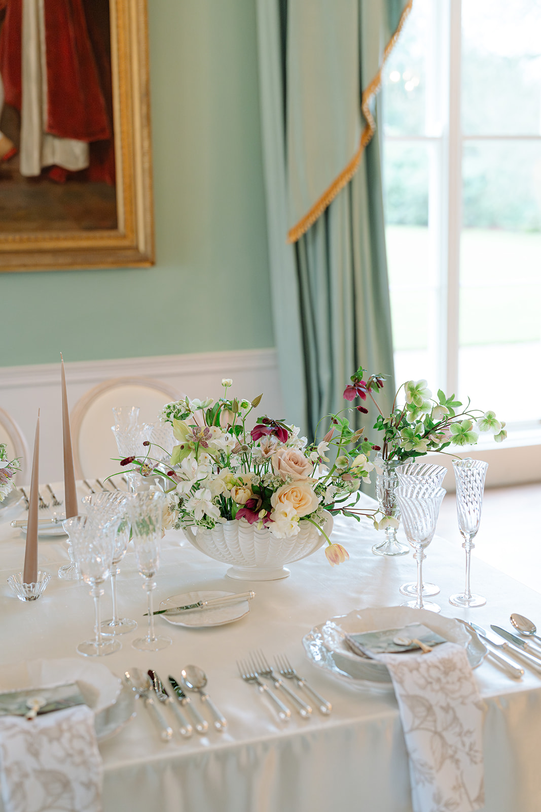 Birdsall House A colour image of a beautiful wedding place setting planned by soiree studio, featuring neutral tones and luxury glassware.