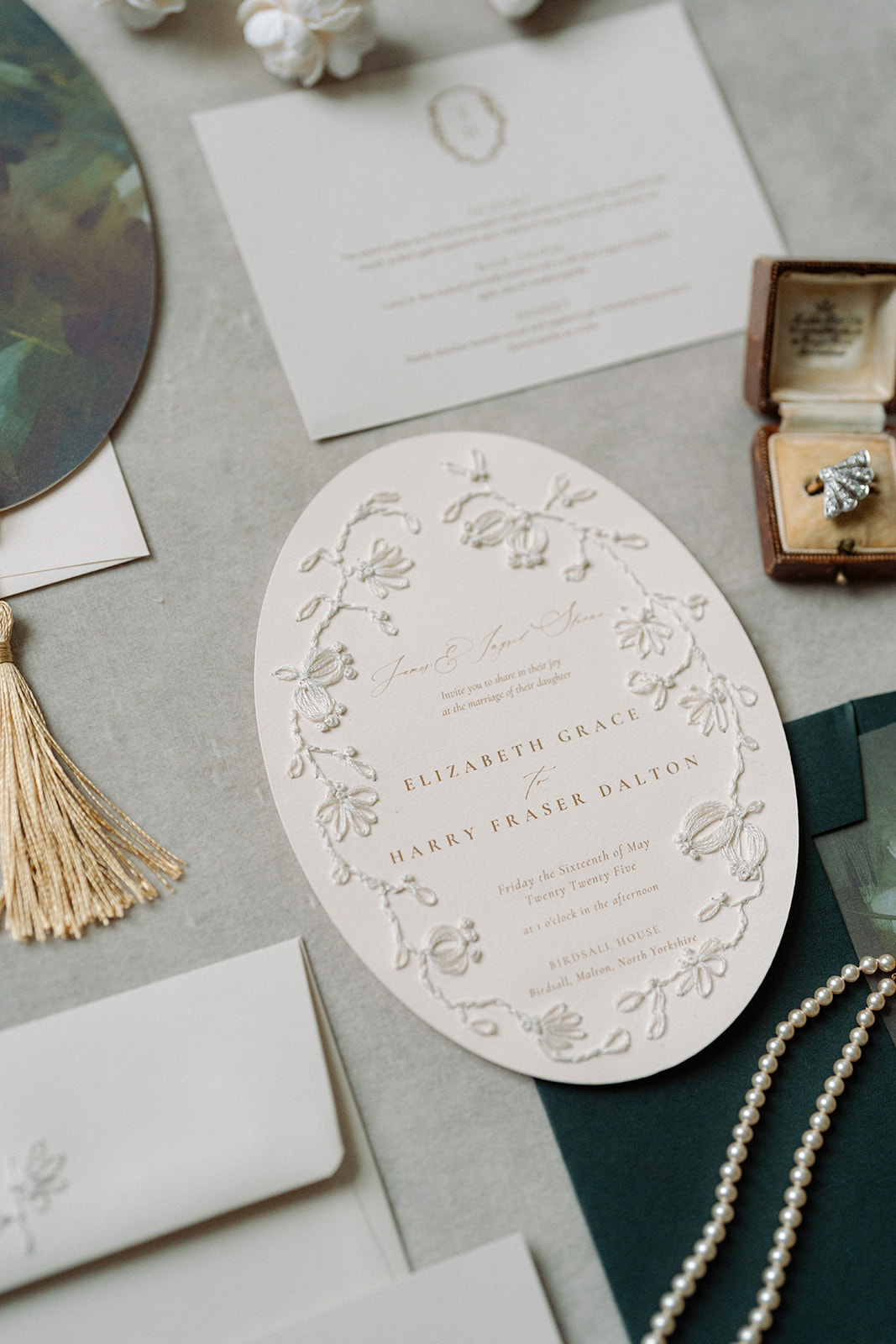 Birdsall House A colour image of Bespoke heirloom wedding stationery, hand embroidered in blush tones by Soiree Studio Wedding planning and production.
