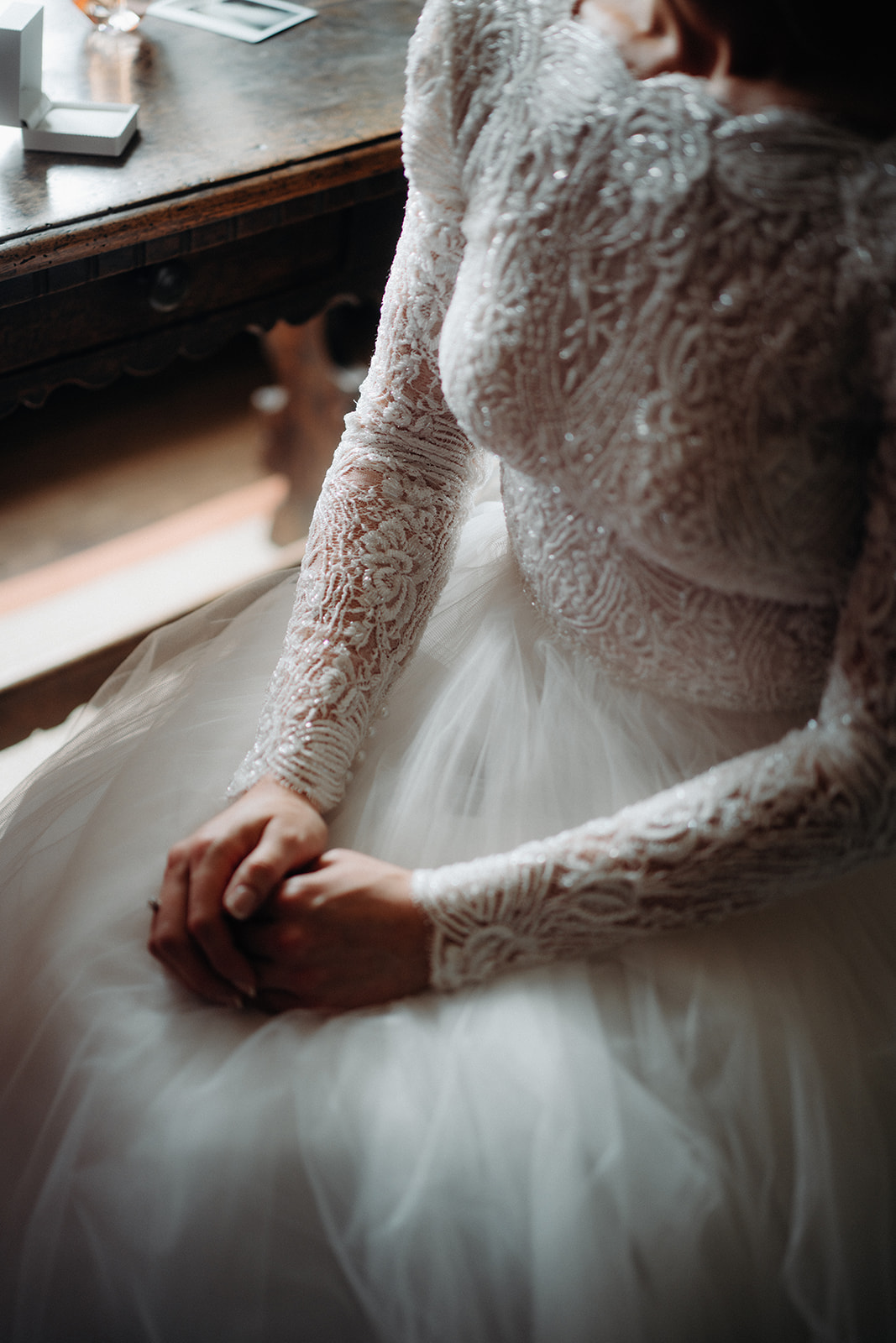 Amy and Jack Colour image of the decorate beaded detailing on a brides dress at Dorfold Hall in cheshire.