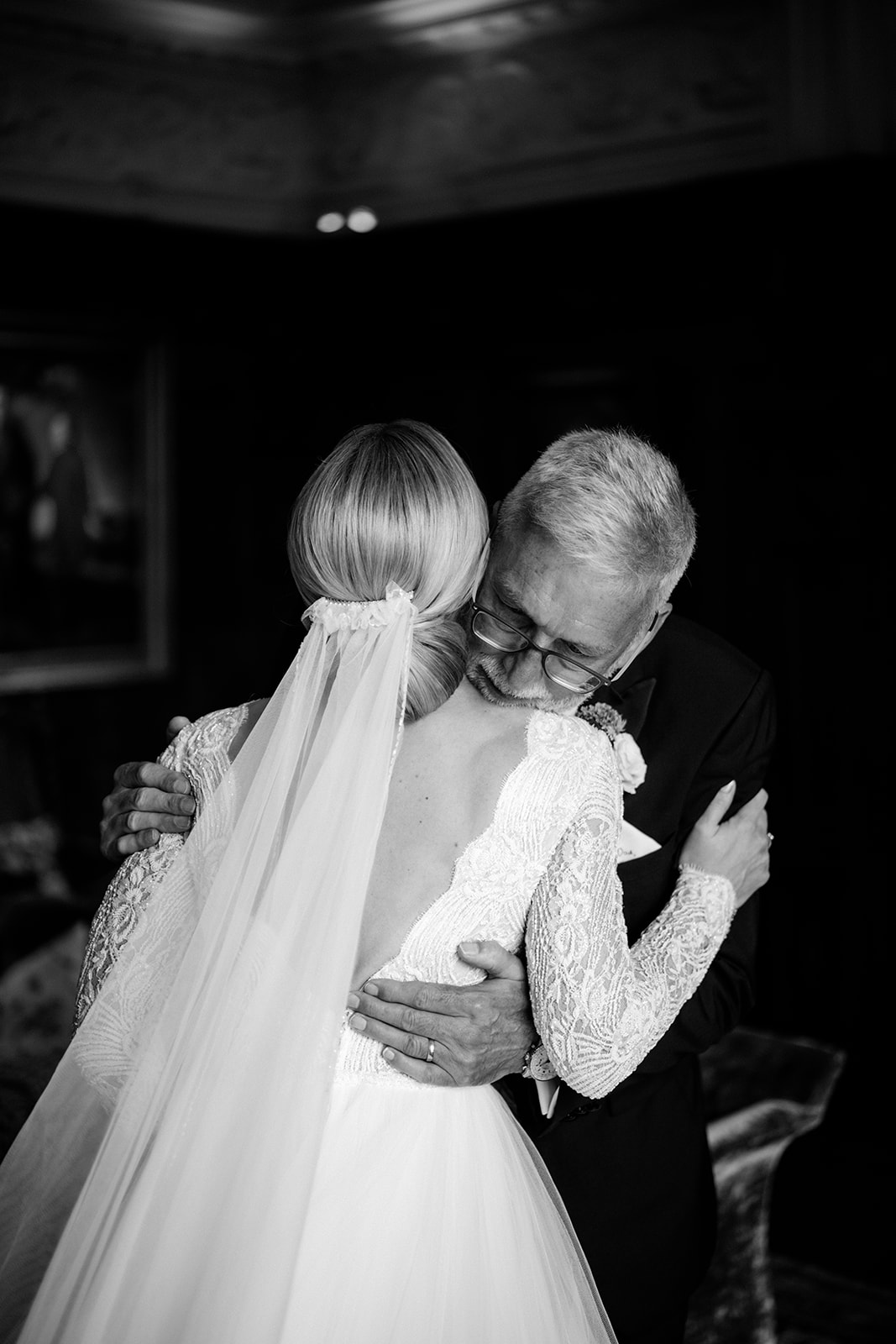 Amy and Jack A black and white image of a bride hugging her Dad before walking down the aisle at Dorfold Hall Cheshire.