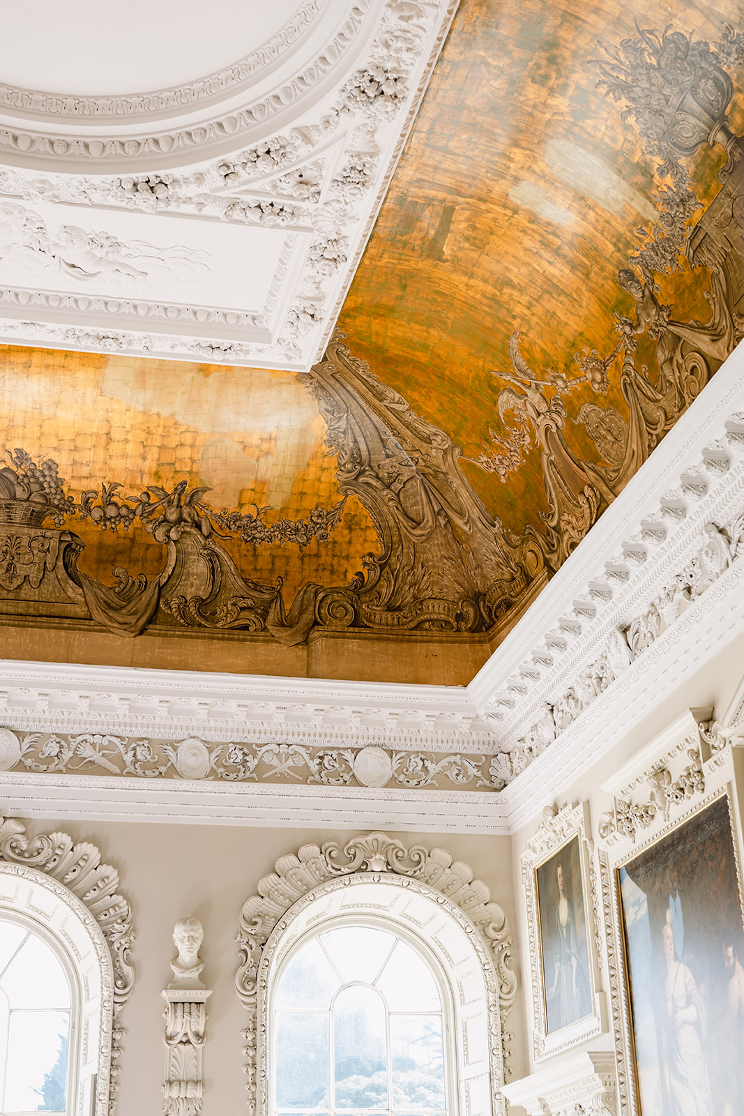 A colour image of the grand decorative ceilings at Hawkstone Hall after a wedding planned by Soiree Studio.