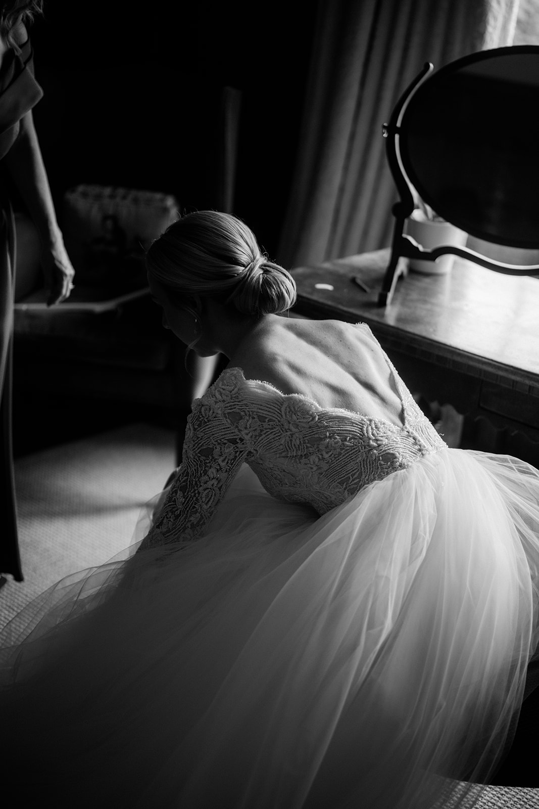 Amy and Jack A black and white image of a bride getting ready for her wedding day at Dorfold Hall in Cheshire.