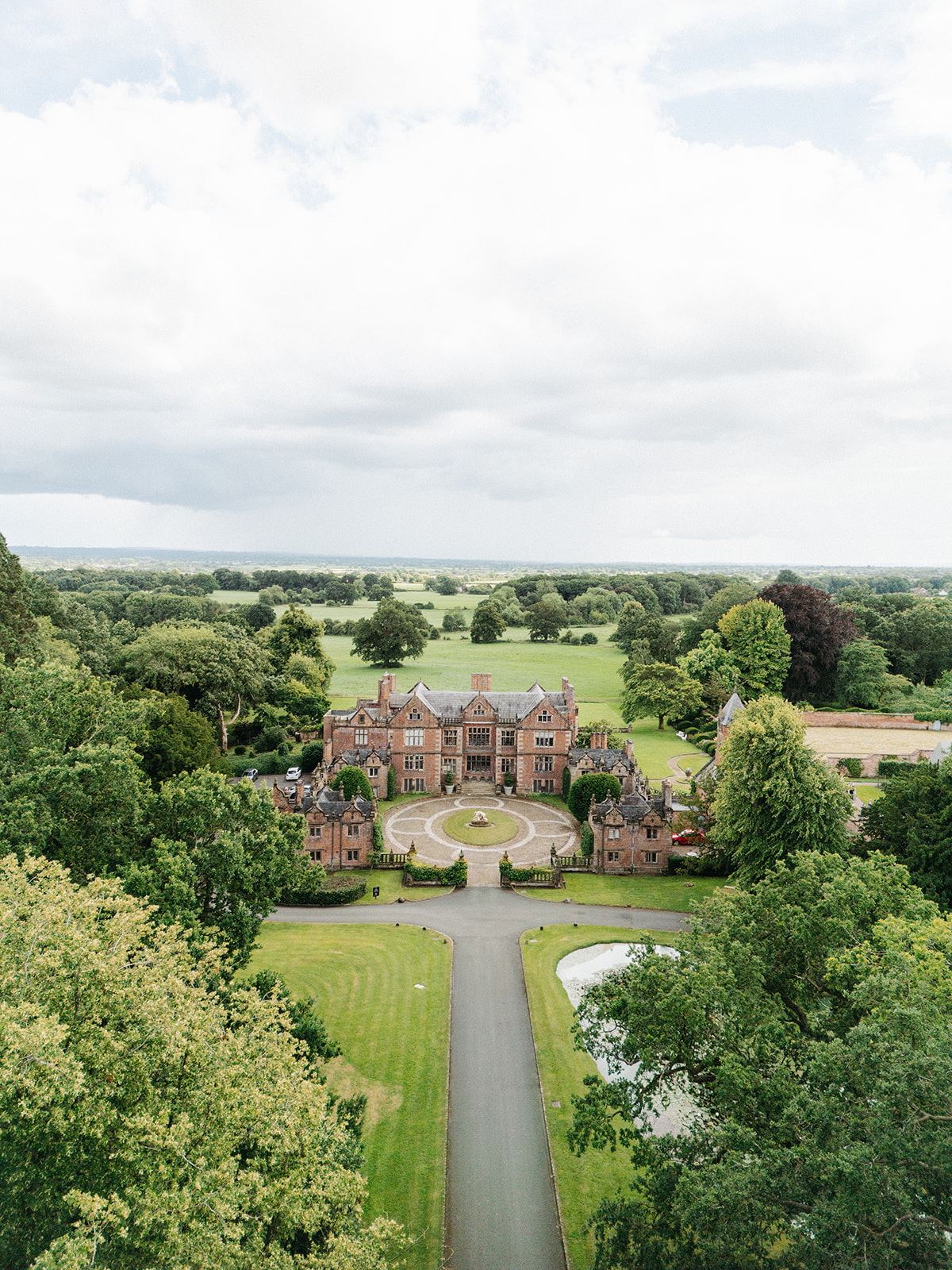 Amy and Jack A colour image of a birds eye view over Dorfold hall luxury wedding venue in Cheshire.