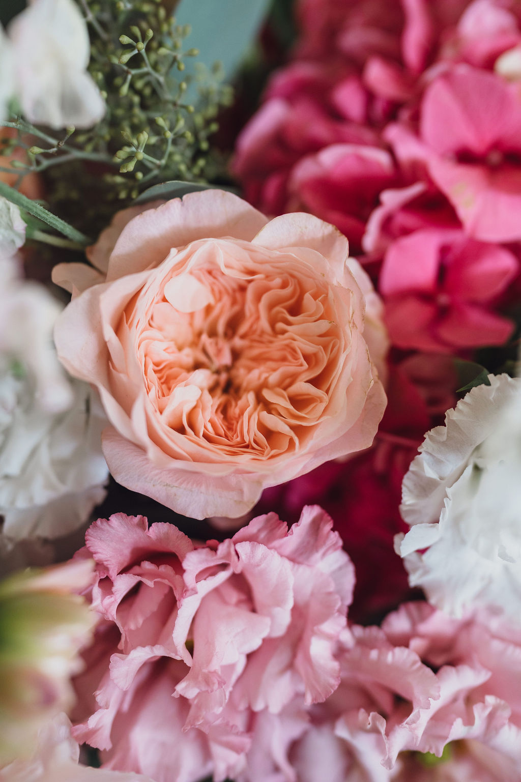 wedding-floristry-for-marquee-wedding-shropshire A colour image of beautiful soft summer flowers for a marquee wedding in Nantwich with hydrangeas and roses.