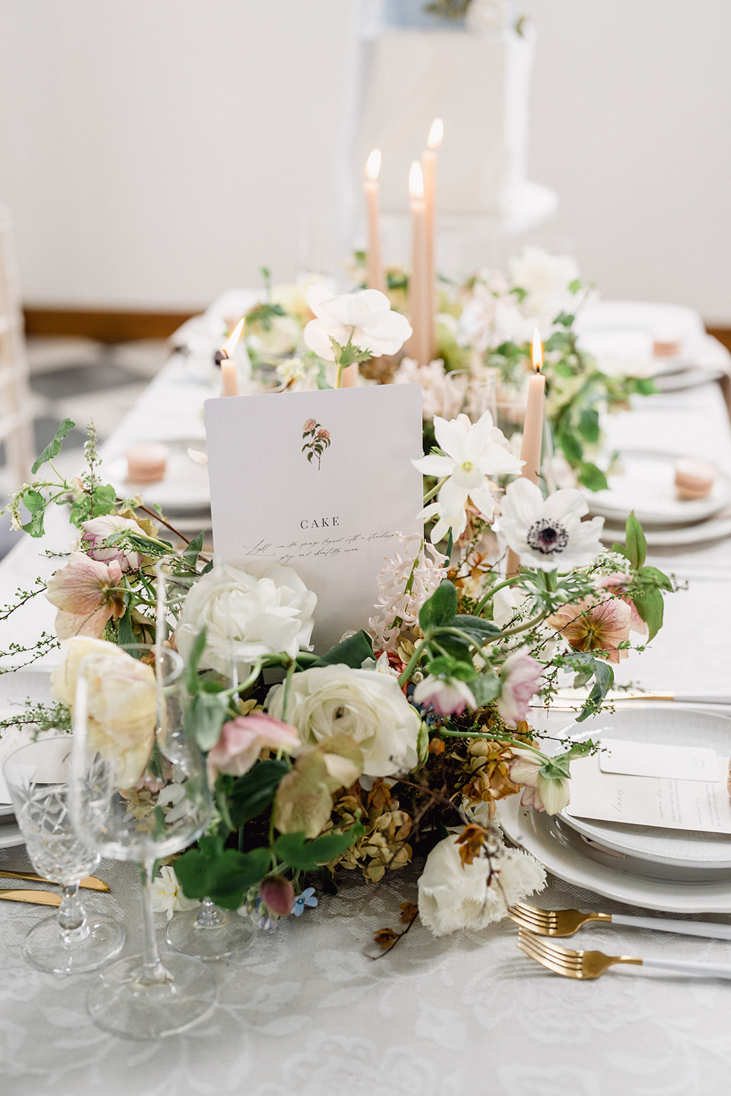 A colour image of a spring wedding table styled for a wedding at Hawkstone Hall with neutral linens and muted tones.