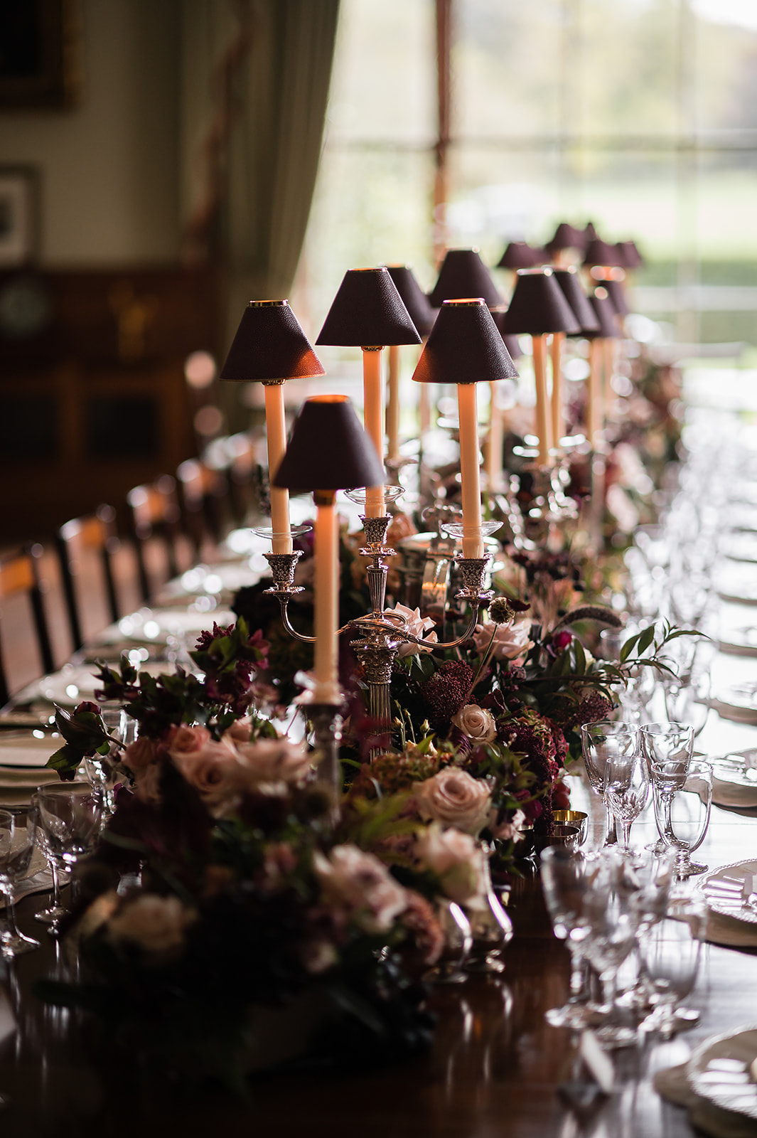 A colour image of the dining table at Birdsall House wedding venue - planned by wedding planner Soiree Studio.