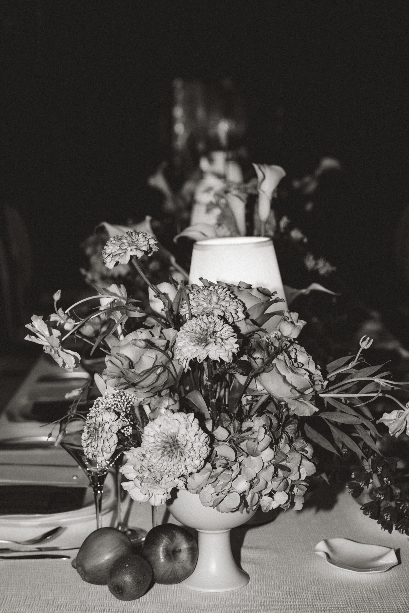 A black and white editorial style image of a styled wedding table at Arley Hall Cheshire.