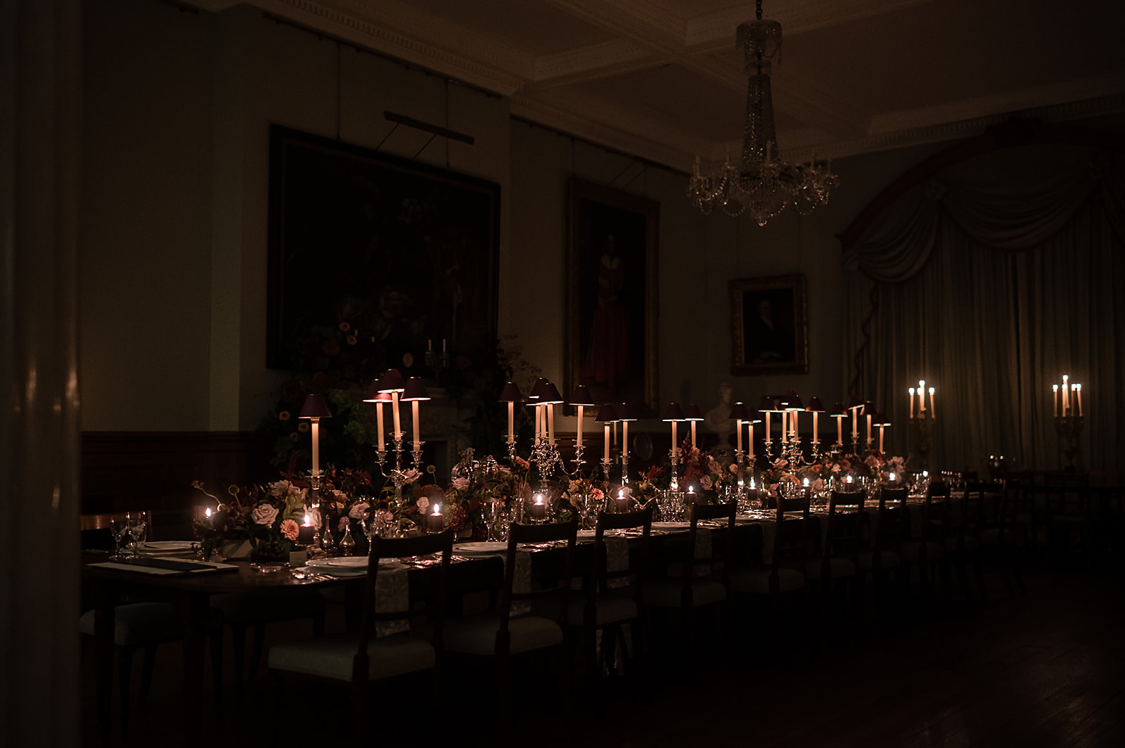 A black and white image of a married couple on the stairs at Birdsall House. 