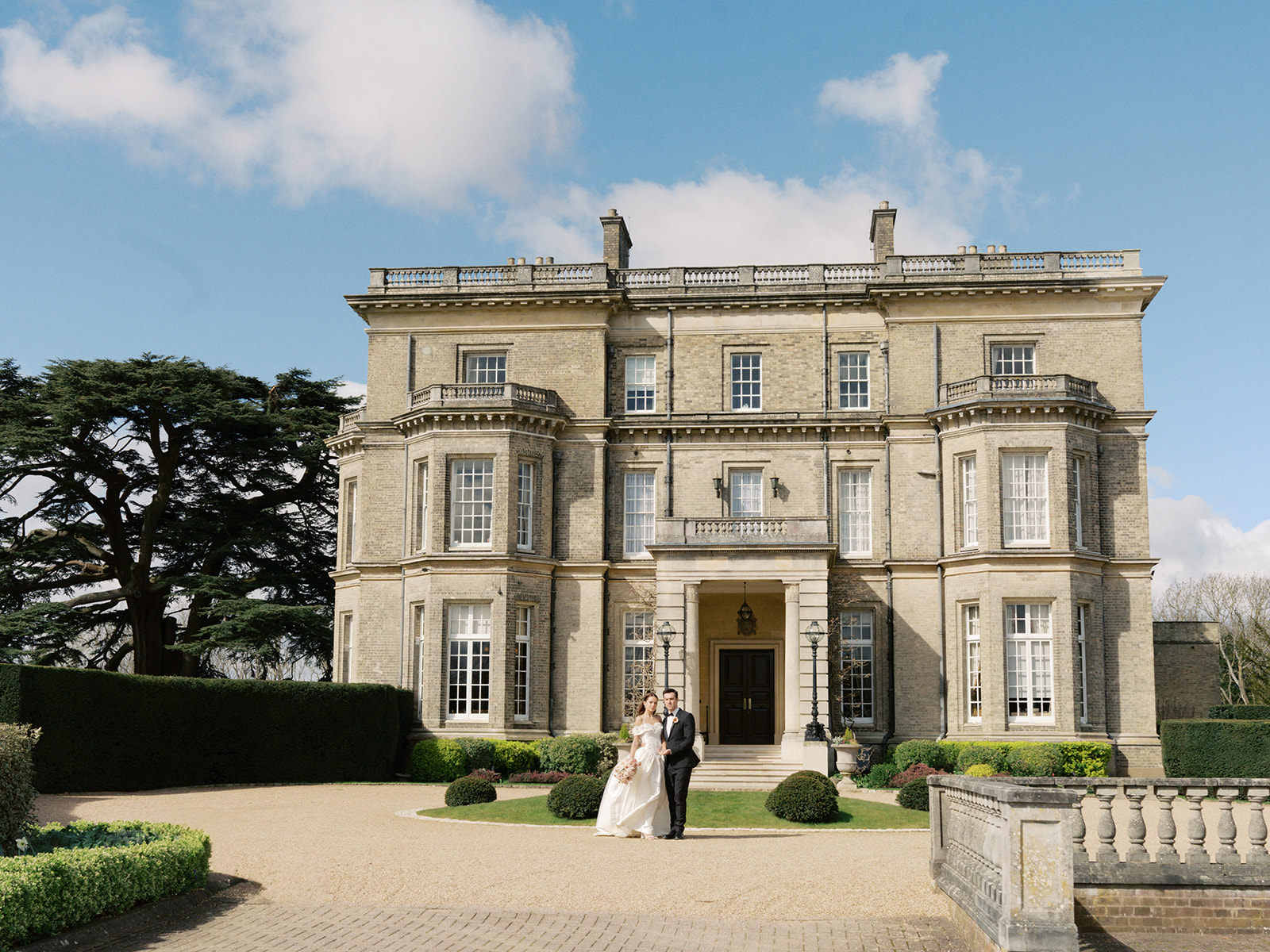 A colour image of the dining table at Birdsall House, UK wedding venue, styled for an evening rehearsal dinner with lots of candles.