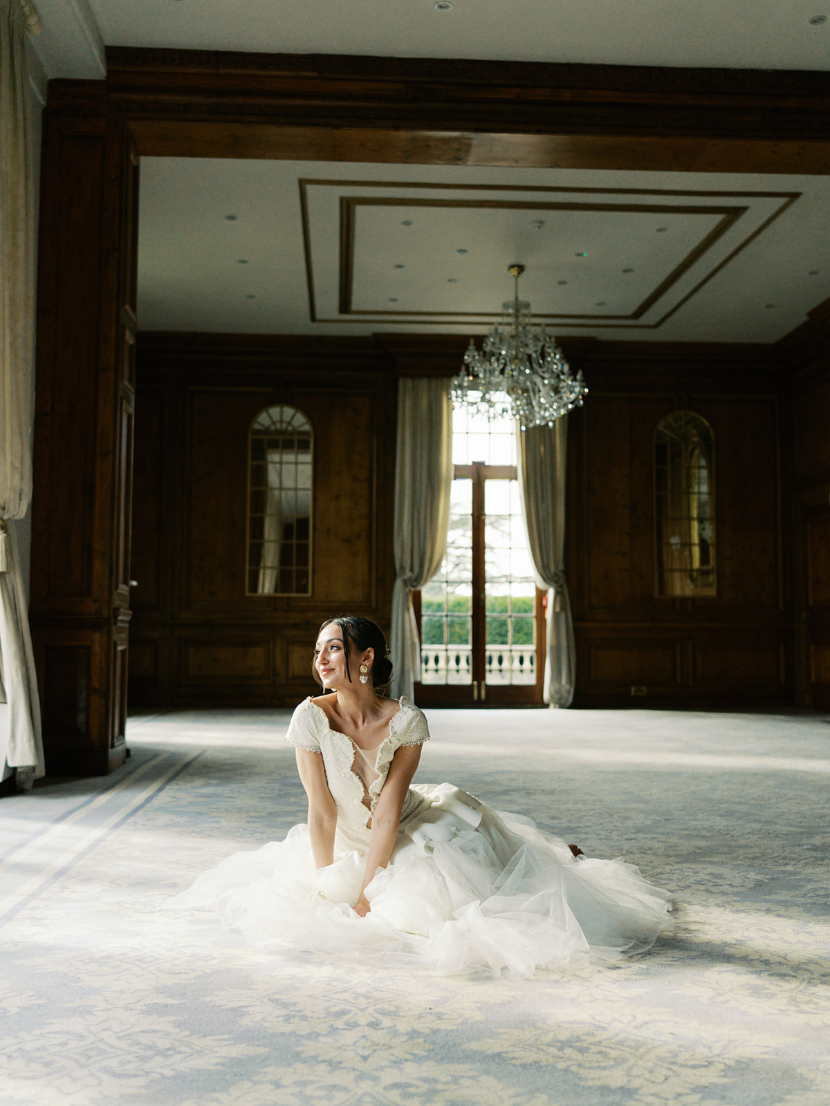 A colour image of summer wedding flowers with peach and pink tones at a wedding planned by design-led wedding planner soiree studio.