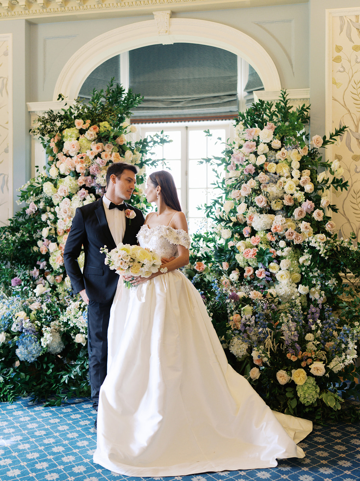 A bride and groom at their wedding ceremony at Hedsor House in the UK. 