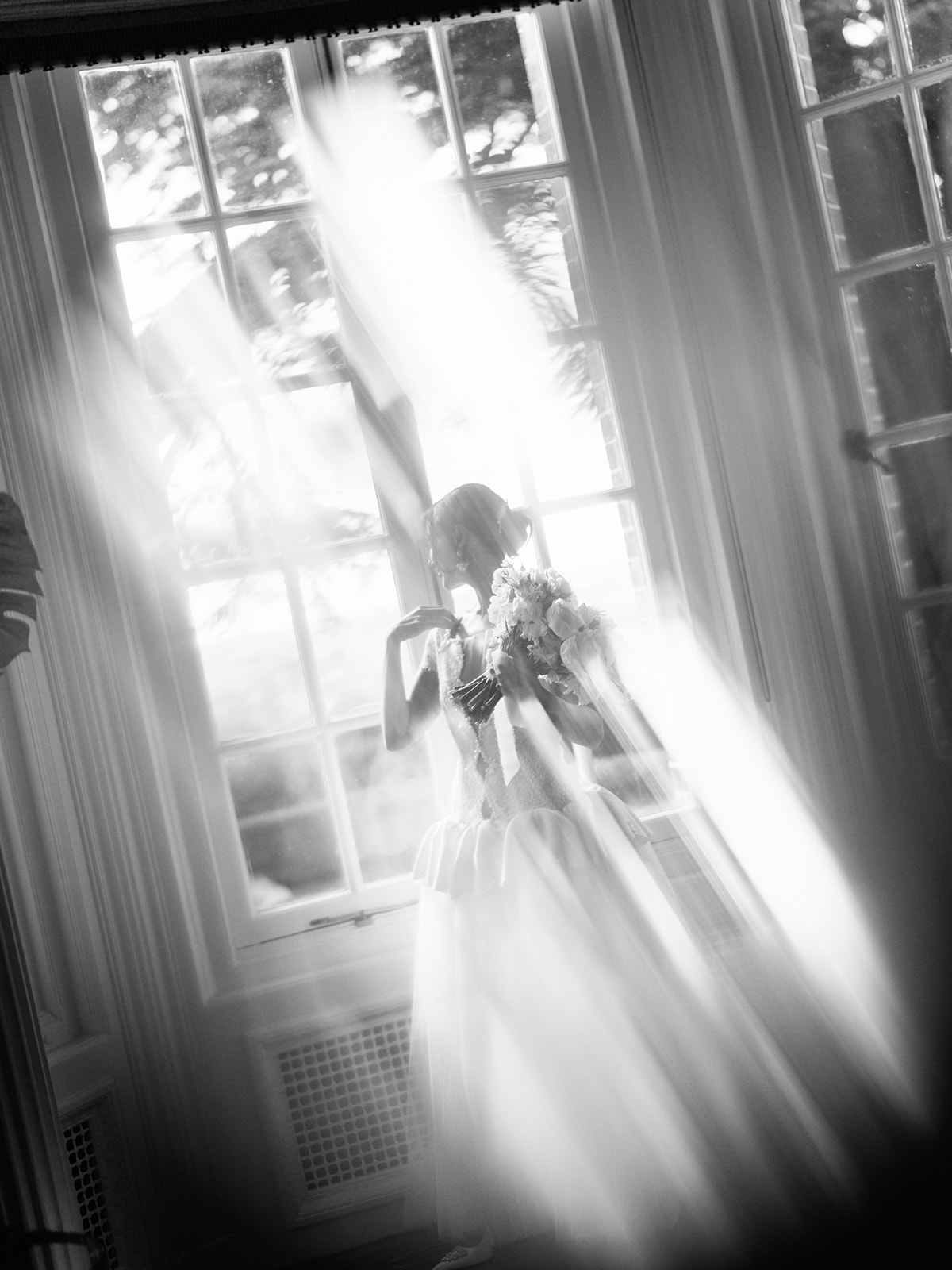 A colour image of a place setting for a wedding with spring flowers by Soirée Studio at Hedsor House.